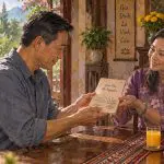 Vietnamese man receives family history records of four generations of ancestors for temple work.