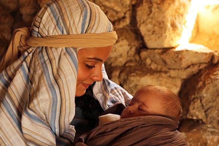 Mary cradles the Christ child at christmas, symbolizing the birth of Jesus Christ and the hope He brings to the world