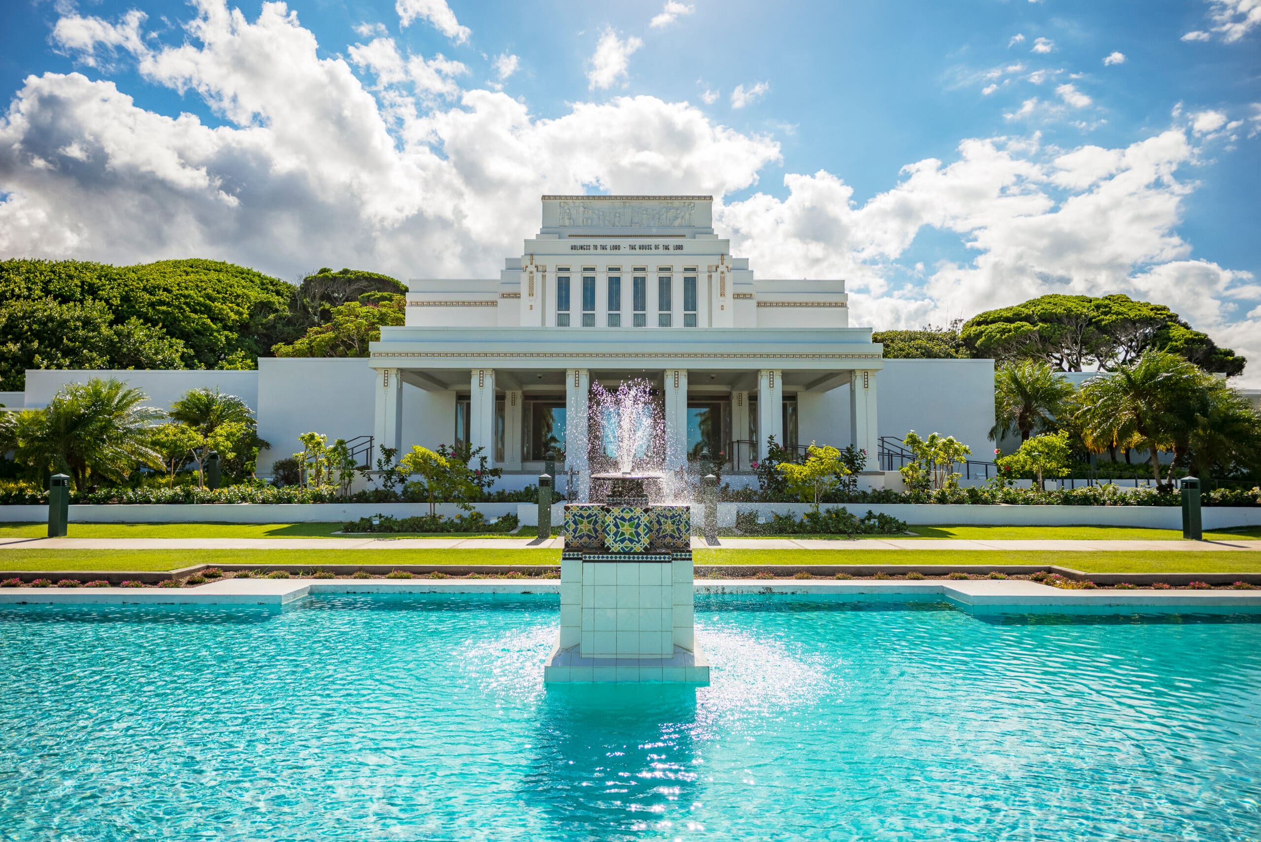 Laie Hawaii Temple with reflection pool, symbolizing sacred missionary service and dedication to the work of the Lord.