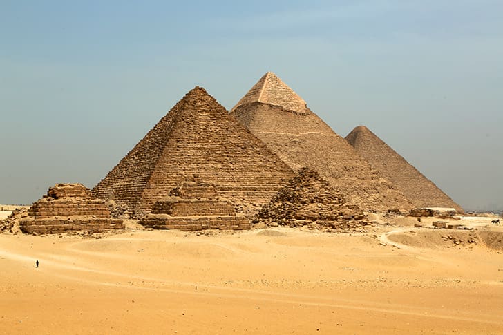 The pyramids of Giza on the Giza Plateau, showcasing ancient Egypt's architectural marvels.
