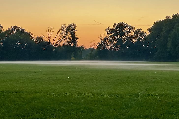 As the sun sets, a low-lying fog begins to spread across the fields of Hawn’s Mill, evoking the solemn memory of the 1838 massacre of 18 Latter-day Saints.