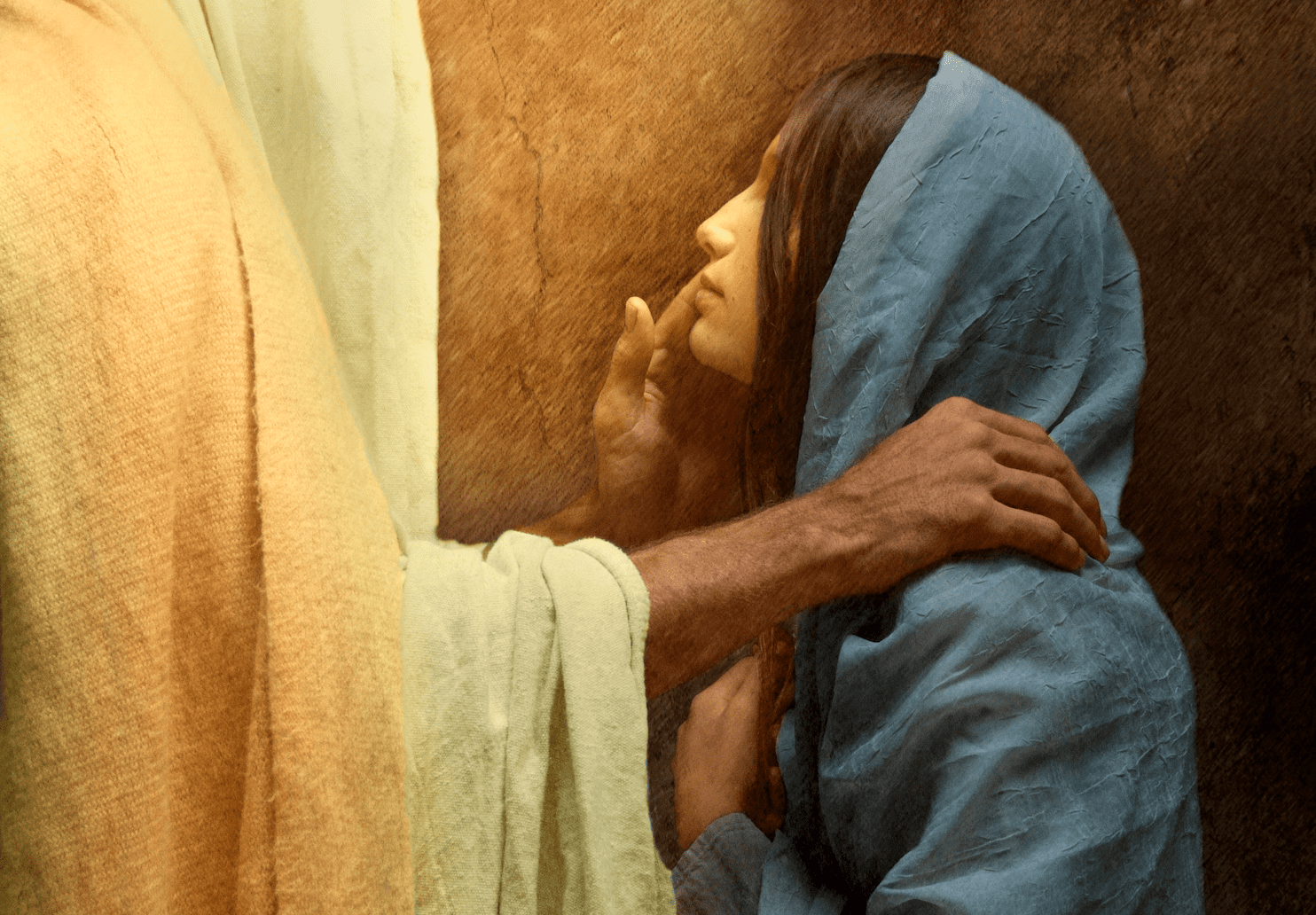 Jesus comforting a woman, representing hope and humility in divine grace.