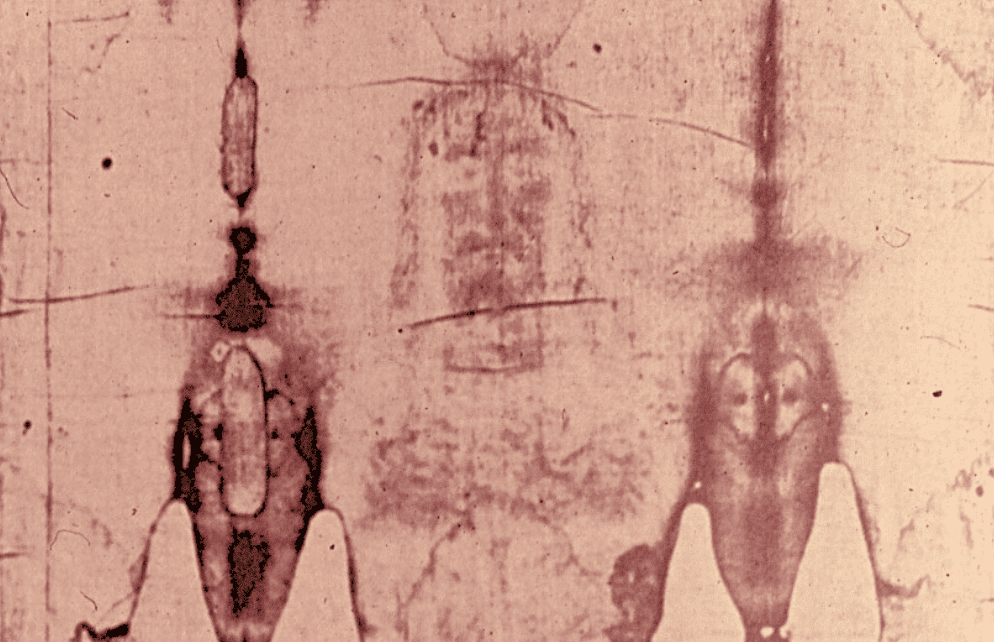Negative image of Shroud of Turin with front and back view of a figure
