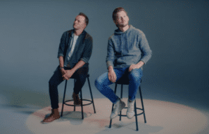 Ben and Chad Truman of the Truman Brothers in a studio setting promoting their Christmas song God Blessed Us, Everyone.