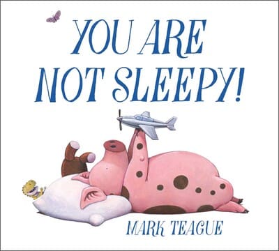 The cover of You Are Not Sleepy! by Mark Teague, showcasing a pink pig lying on a pillow surrounded by toys, perfect for bedtime laughs.