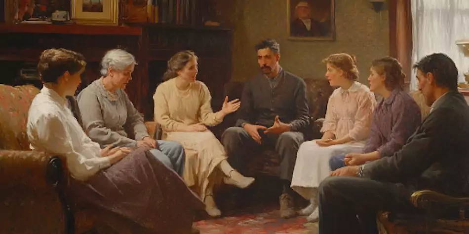 A family sitting together in a living room, discussing and sharing, symbolizing the role of family in fostering growth, reconciliation, and spiritual virtue.