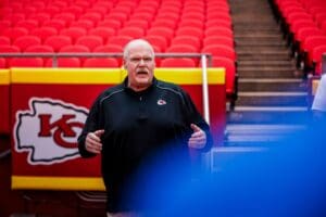 Kansas City Chiefs head coach Andy Reid at Arrowhead Stadium, discussing coaching strategy. A BYU study explores his fourth-down decision-making tendencies.