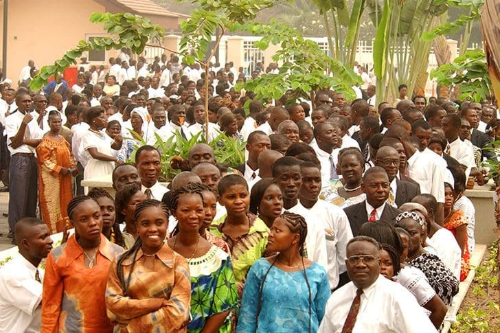 Latter-day Saints gathered outside church meetinghouse in Africa representing the global gathering of Israel