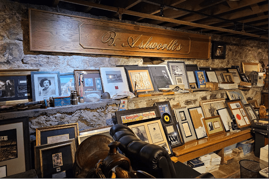 Wall of framed historical Church artifacts from Brent Ashworth’s private collection