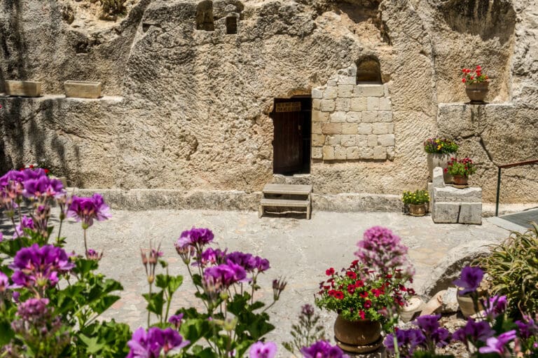 The Garden Tomb in Jerusalem with blooming flowers, symbolizing Christ’s Resurrection during Easter.