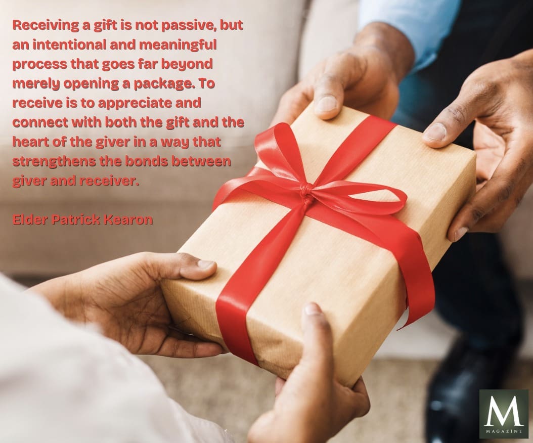 A gift wrapped in red ribbon being given, representing Elder Patrick Kearon’s insight: “Receiving a gift is not passive, but an intentional and meaningful process… that strengthens the bonds between giver and receiver.”