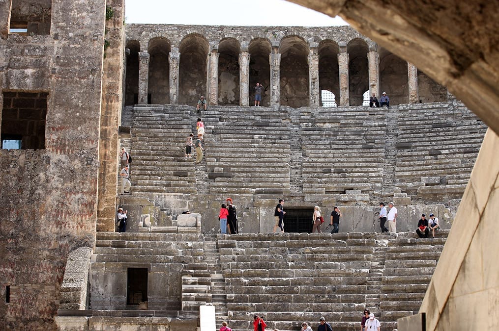 Travelers explore a massive ancient Roman amphitheater connected to the world of the Apostle Paul and early Christianity in Turkey.