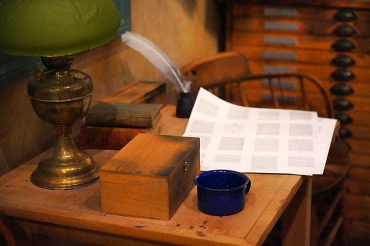 Early Church desk with quill, papers, and lamp symbolizing faithful stewardship in Doctrine and Covenants 51–57