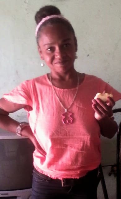 Elder Perez’s birth mother smiles while holding bread in her new safe home. After wandering the streets due to untreated schizophrenia, she was rescued and lovingly cared for by members of the Church in the Dominican Republic.