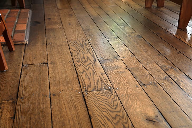 Close-up of original wooden floorboards inside Carthage Jail where John Taylor fell wounded and crawled to safety during the mob attack and where Hyrum Smith died 