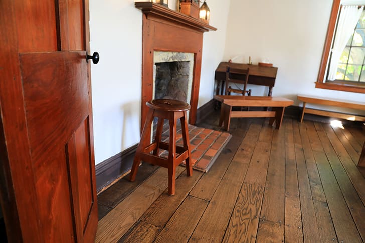 Restored main room inside Carthage Jail, including original furnishings where the Prophet Joseph Smith and his companions spent their final hours.