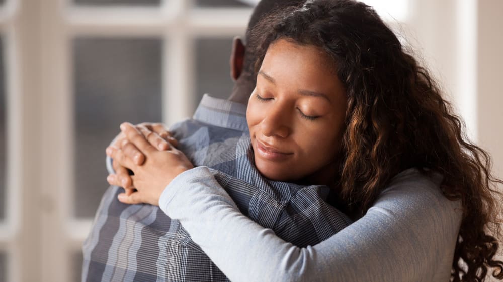 Couple embracing in a tender moment, symbolizing Christlike compassion in marriage