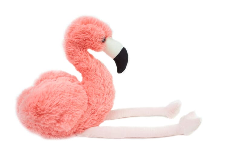 Stuffed flamingo toy with pink plush body and floppy legs, like the one Annie found in the secondhand store.