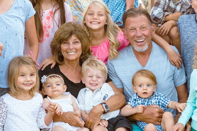 Richard and Linda Eyre smiling with grandchildren, representing how to live the second half of life with family connection and purpose.