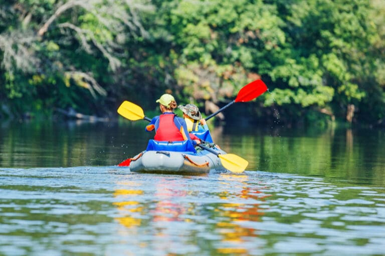 Children kayaking at Kayak Camp in the Provo River Delta, learning environmental stewardship