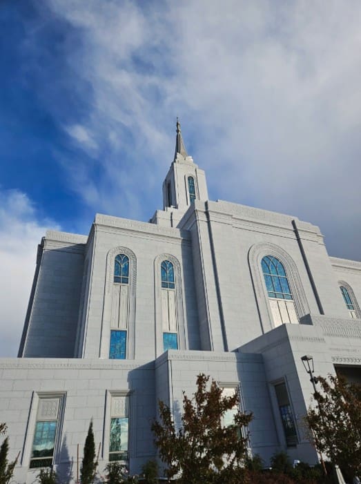 A bright, blue-sky view of a Latter-day Saint temple, representing the fulfillment of Joseph Smith’s vision of temples dotting the land.