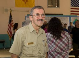 Tom Harbour, a veteran wildland firefighter and Latter-day Saint, stands at a fire safety awareness event. His decades-long career focused on preventing firefighter fatalities and supporting mental health resilience in the field.