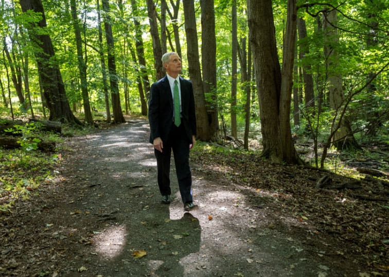 Elder David A. Bednar at the refurbished Hill Cumorah historic site in Palmyra, New York, where Joseph Smith received the gold plates of the Book of Mormon.