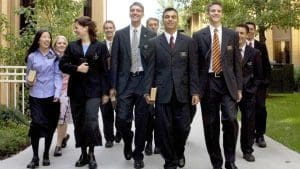LDS missionaries walking together holding scriptures, symbolizing faith, service, and the missionary tool of love and example.