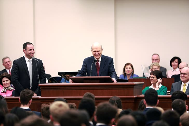 President Russell M. Nelson speaks to a congregation of Saints, exemplifying his role as a prophet of God who taught truth with clarity, kindness, and power.