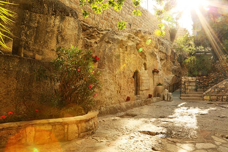 Sunlit entrance to the Garden Tomb in Jerusalem, symbolizing Christ’s resurrection, victory over death, and eternal life.