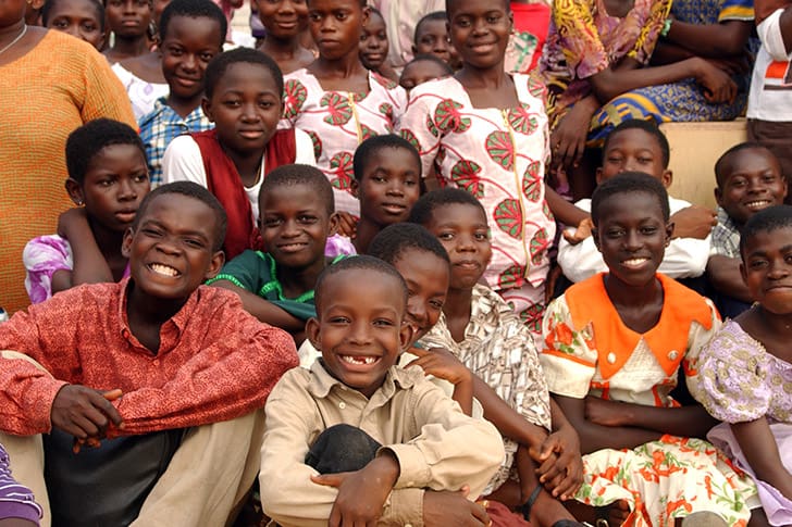Smiling children in Africa, representing the joy and blessings of families gathered into the covenant during the gathering of Israel.