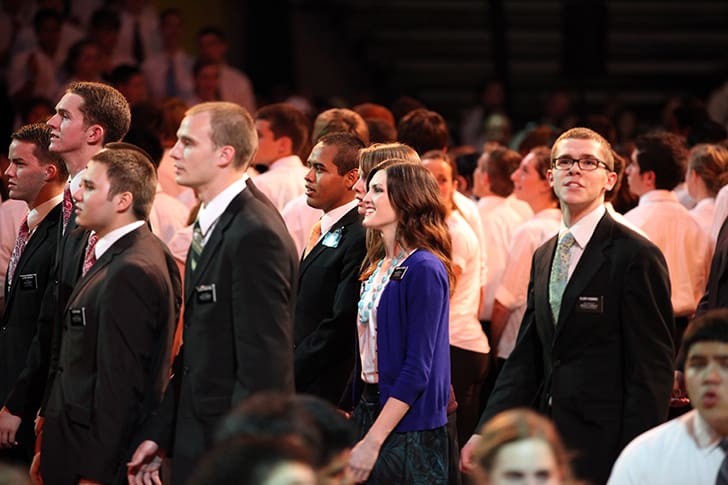 Missionaries gathered in worship and service, fulfilling their role in proclaiming the Restoration and gathering scattered Israel worldwide.