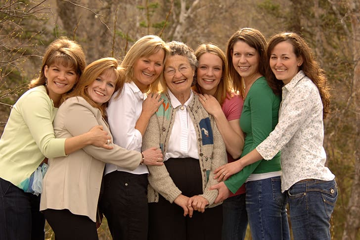 Generations of women from one family smiling together, symbolizing the sealing power and covenant blessings of the gathering of Israel.