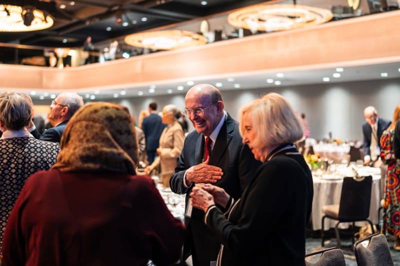 Elder Quentin L. Cook greeting leaders at the Forum on Faith in New York City to discuss religious freedom.