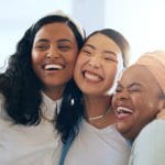 Women showing empathy and Christlike love through friendship and joy, representing the gospel of Jesus Christ and Latter-day Saint discipleship.
