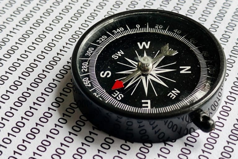 Compass over binary code symbolizing moral direction in artificial intelligence, inspired by Elder Gerrit W. Gong’s Faith and Ethics AI Evaluation at the Vatican.