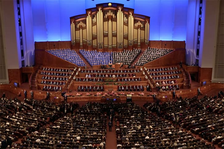 The Conference Center filled with Saints attending General Conference October 2025, featuring Church leaders and the Tabernacle Choir.