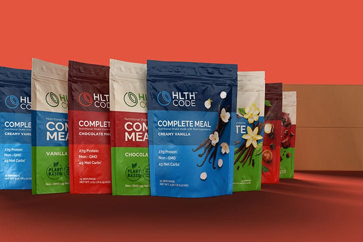 A display of HLTH Code Complete Meal shake flavors, designed for optimal nutrition, weight loss, and improved metabolic health.