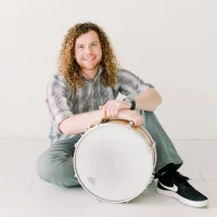 Percussionist Jay Nygaard, a passionate arts advocate, joins Jenny Oaks Baker & Family Four for Joy to the World! A Sacred Celebration on the 2025 Christmas Tour.