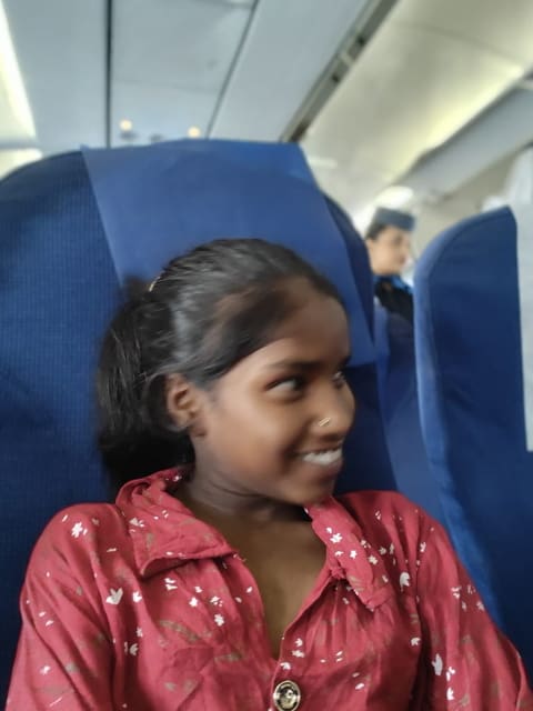 Lakshmi smiles with quiet hope on her way to New Delhi, unaware that the next few weeks would bring a miraculous recovery and renewed faith in God’s love.