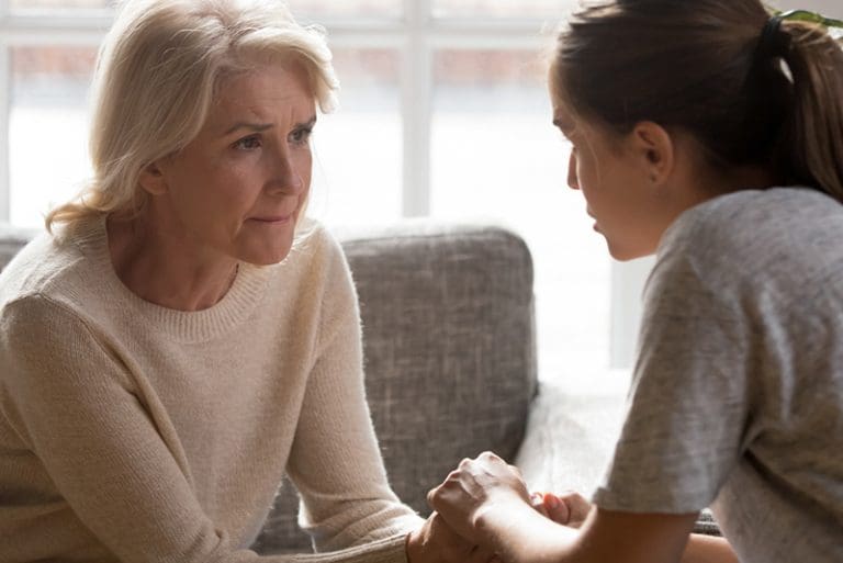 Adult daughter comforting her mother, illustrating faith and healing for adult children of immature parents.