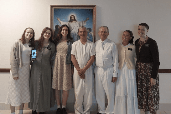Missionaries and members pose after a baptism, symbolizing ongoing faith and the legacy Wilford Woodruff helped record.