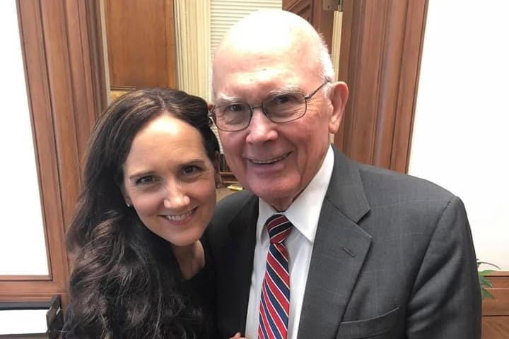 President Dallin H. Oaks standing with his daughter Jenny Oaks Baker, sharing a moment of faith and family.