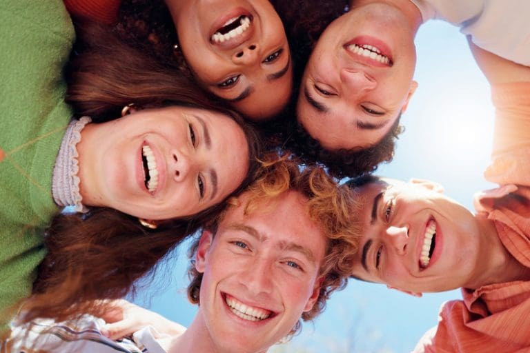 Smiling faces and grateful hearts — joyful youth reflecting missionary faith, service, and happiness in the gospel of Jesus Christ.