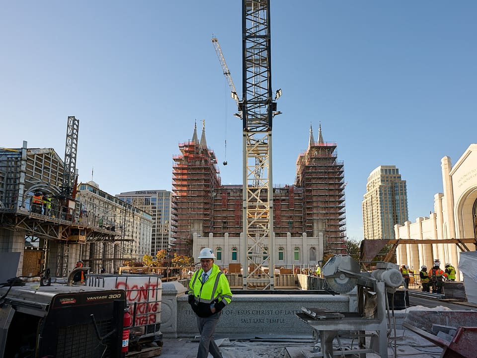 Construction crews continue work on the Salt Lake Temple renovation at Temple Square as scaffolding and cranes remain in place. The project marks major progress toward completion under the Church of Jesus Christ of Latter-day Saints.