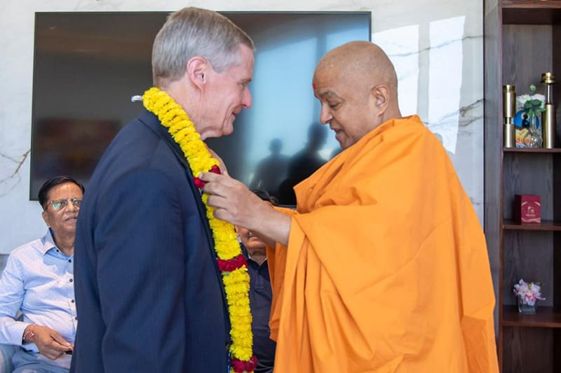 Elder Bednar welcomed with a garland at the BAPS Hindu Mandir in Abu Dhabi during Latter-day Saint interfaith visit.