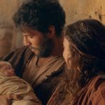 Mary and Joseph holding the newborn Jesus Christ in a stable, illustrating the Savior’s birth from the First Presidency Christmas Message.