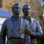 Statue of Joseph and Hyrum Smith at Carthage Jail representing the martyrdom discussed in the Come Follow Me Podcast on Sections 135–136.