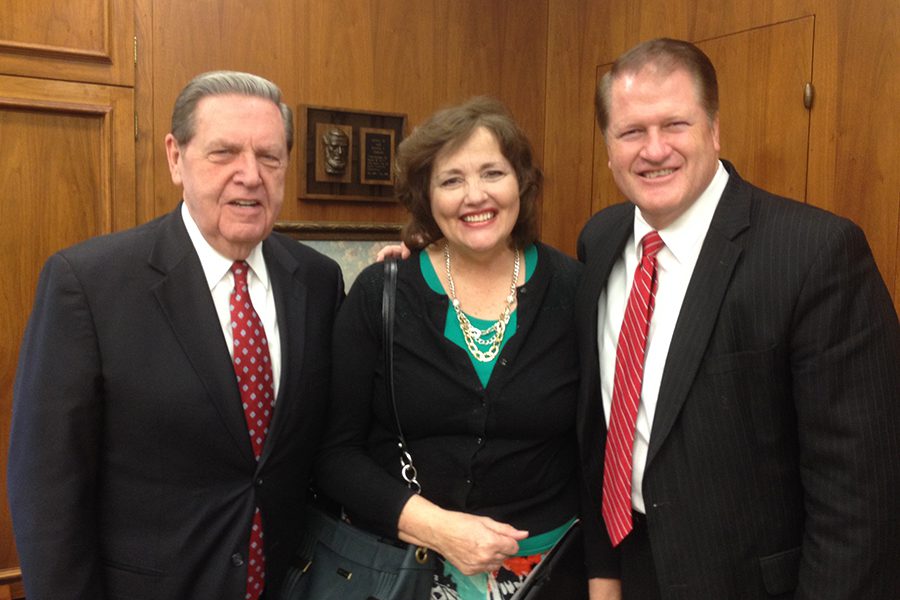 President Jeffrey R. Holland smiling with Maurine and Scot Proctor, reflecting personal friendship and shared faith within the Church.