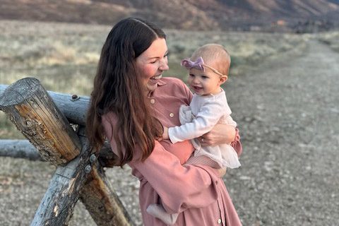 Mother holding her baby in a moment of stillness, illustrating mindfulness, motherhood, and learning to hear God through peaceful parenting